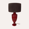 Decorative table lamp in burgundy colored ceramic